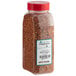 A clear container of red granules.