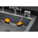 A Guardian Equipment AutoFlow left hand deck mounted eye and face wash station with two orange faucets.