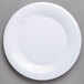 A Carlisle white melamine plate with a wide rim.