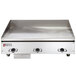 A Wolf stainless steel countertop griddle with thermostat controls.