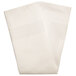 A folded cream cloth napkin with a white satin band.