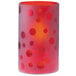 A red glass Sterno candle holder with engraved dots.