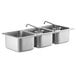 A row of three Regency stainless steel drop-in sink bowls with swing faucets.