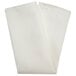 A cream Milan Birdseye cloth napkin folded on a white surface.