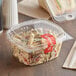 A clear plastic Choice deli container of pasta salad with a clear plastic lid.
