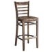 A Lancaster Table & Seating wood ladder back bar stool with a wood seat and back.