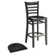 A Lancaster Table & Seating black wood ladder back bar stool with black wood seat.