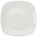 A white square Tuxton china plate with a white rim.