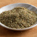 A bowl of Regal bulk dried herb blend.