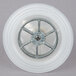 A white plastic wheel with a metal rim.