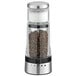 An OXO Good Grips pepper mill with a glass container filled with pepper seeds.