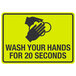 A yellow sign with black text reading "Wash Your Hands For 20 Seconds" above a symbol of hands washing.