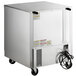 A large stainless steel Beverage-Air undercounter refrigerator with a wire and wheels.