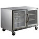 A stainless steel Beverage-Air undercounter freezer with two glass doors.