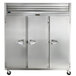 A large Traulsen G Series reach-in refrigerator with three white doors and handles.