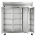 A white Traulsen G Series reach-in refrigerator with stainless steel doors and silver handles.