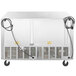 A stainless steel Beverage-Air undercounter refrigerator/freezer with a hose and wires.