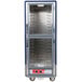 A blue Metro C5 heated holding cabinet with clear Dutch doors.