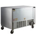 A stainless steel Beverage-Air undercounter freezer with glass doors on wheels.