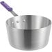 A Choice aluminum sauce pan with a purple silicone handle.