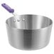 A silver aluminum sauce pan with a purple silicone handle.