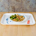 A Thunder Group Blue Bamboo melamine tray holding a white plate of rice and vegetables.