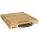 A John Boos maple wood cutting board with a metal tray on one end.