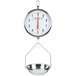 A Cardinal Detecto hanging pan scale with double dials weighing a metal bowl.