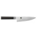 A Shun Classic chef knife with a black handle and silver blade.