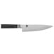 A Shun Classic chef knife with a black handle.