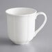 An Acopa Condesa white porcelain mug with a scalloped handle.