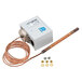 A white box with a Heatcraft defrost term switch and a copper wire with metal nuts.