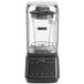 An AvaMix Apex commercial blender with a clear container and black lid on a countertop.