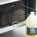 A close-up of a Noble Chemical Tech Line 1 Gallon Concentrated Foaming Heavy-Duty Condenser Coil Cleaner bottle.