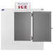 A white Leer ice merchandiser with a galvanized steel door open and a sign for packed ice.