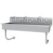 A stainless steel Advance Tabco wall mounted utility sink with three faucets.