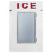 A white Leer indoor ice merchandiser with a glass door and the word "ice" on it.