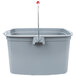 A Rubbermaid gray bucket with a red handle and divider.