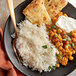 A plate of Royal Basmati Rice and chickpea curry with a fork.