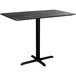 A black rectangular Lancaster Table & Seating counter height table with a black metal base.