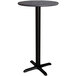 A Lancaster Table & Seating bar height table with a black cross base.