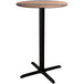 A Lancaster Table & Seating round bar height table with a black base.