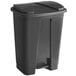 A Lavex black rectangular step-on trash can with a lid.