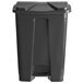 A black plastic Lavex rectangular step-on trash can with a lid.