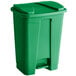 A green plastic Lavex rectangular step-on trash can with a lid.
