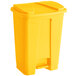 A yellow rectangular Lavex step-on trash can with a lid.