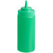 A green plastic squeeze bottle with a wide mouth lid.