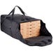 A black Vesture NextPhase insulated delivery bag with pizza boxes inside.