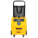 A yellow Vapamore MR-1000 Forza steam cleaner in a black mesh bag.