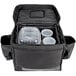 A black Vesture heavy-duty insulated catering bag with plastic containers inside.